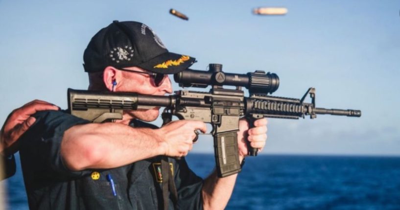 Navy Cmdr. Cameron Yaste was relieved of duty on Friday, after appearing in this photo on an official Navy Instagram account in April, which drew heavy criticism.