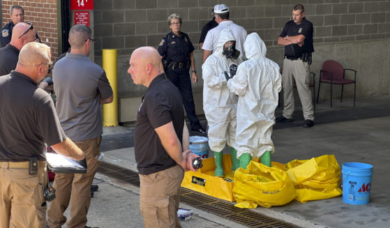 A hazmat crew from the National Guard's Civilian Support Team investigates after a suspicious package was delivered to election officials at the Missouri Secretary of State's Jefferson City, Missouri, office on Tuesday.