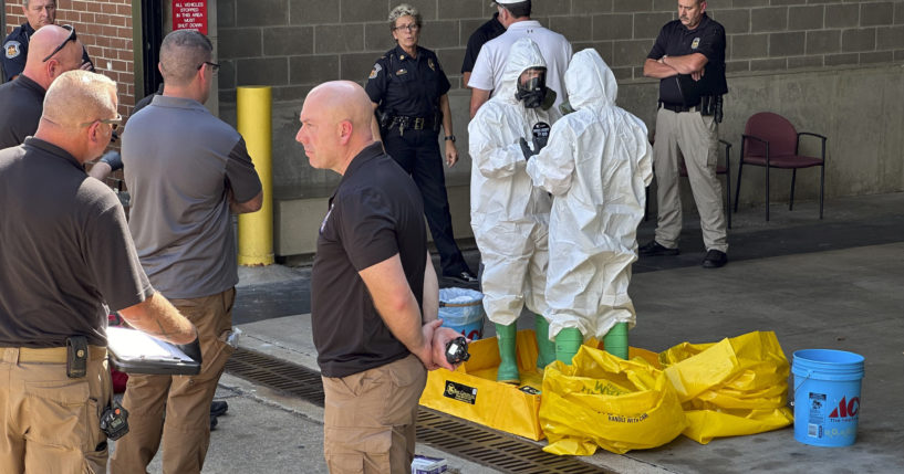 A hazmat crew from the National Guard's Civilian Support Team investigates after a suspicious package was delivered to election officials at the Missouri Secretary of State's Jefferson City, Missouri, office on Tuesday.