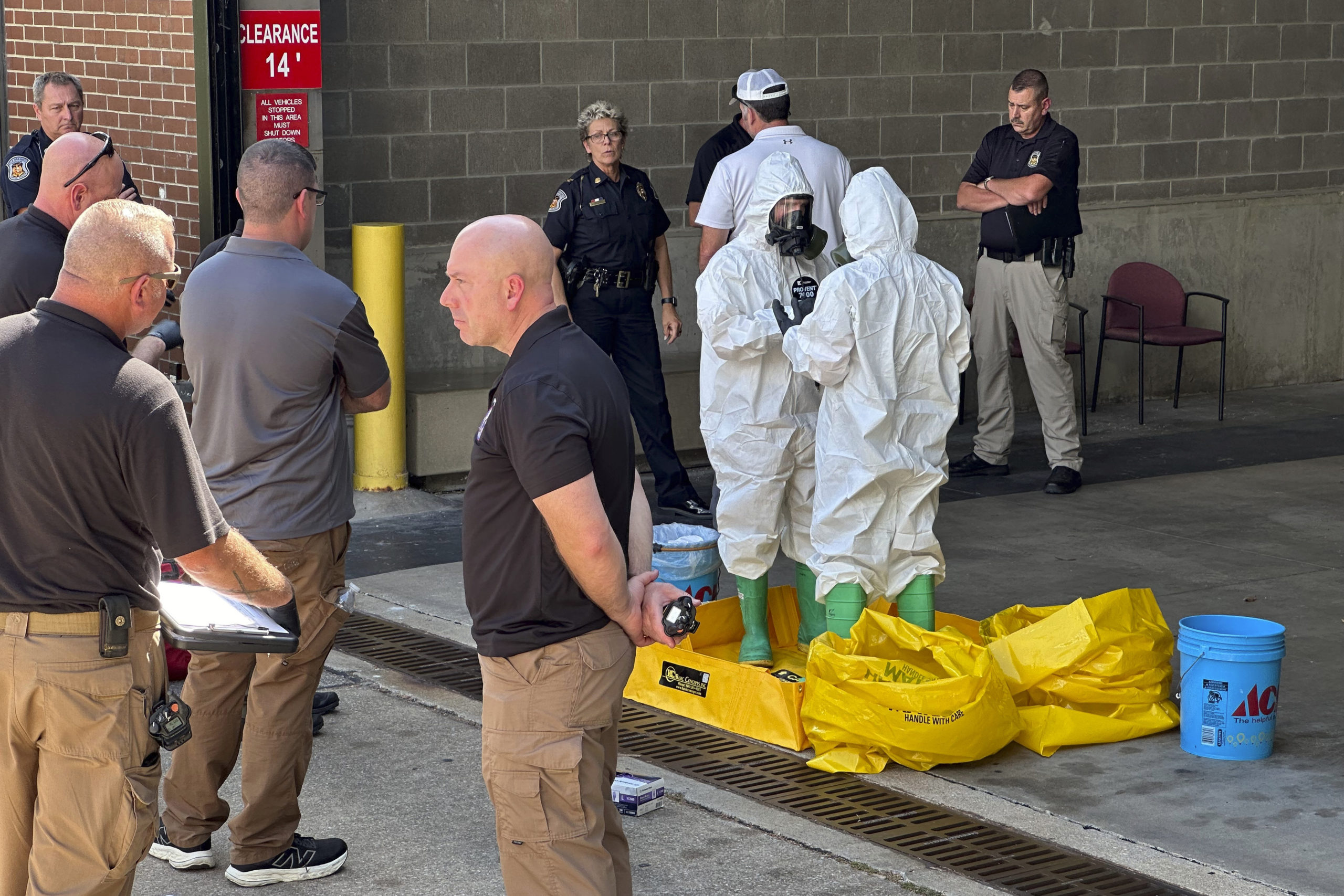 A hazmat crew from the National Guard's Civilian Support Team investigates after a suspicious package was delivered to election officials at the Missouri Secretary of State's Jefferson City, Missouri, office on Tuesday.