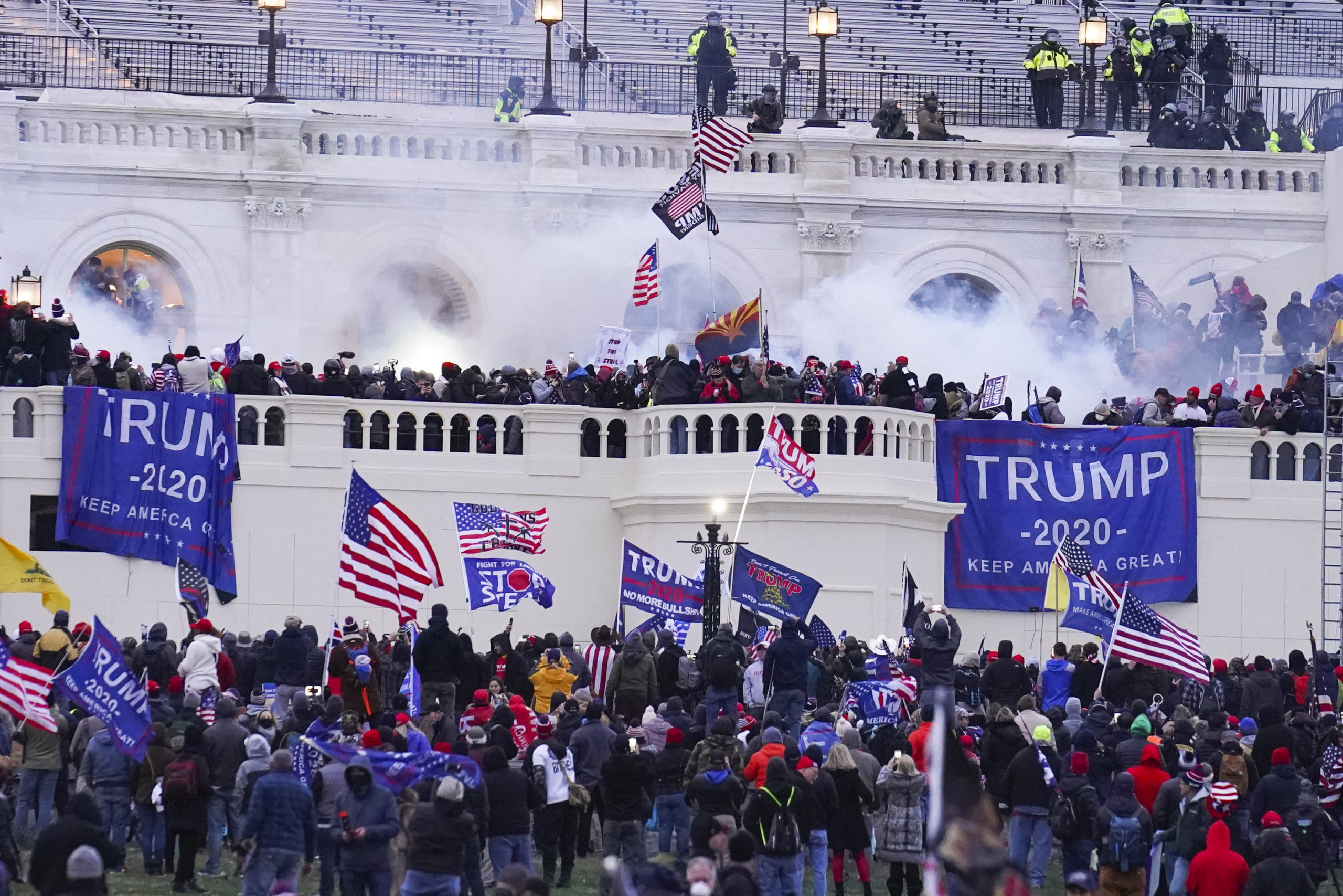 Rioters at the U.S. Capitol on January 6, 2021, in Washington. A former Virginia police officer who stormed the U.S. Capitol has received a reduced prison sentence of six years. Former Rocky Mount Police Sgt. Thomas Robertson's re-sentencing on Wednesday makes him one of the first beneficiaries of a recent U.S. Supreme Court ruling that limited the government’s use of a federal obstruction law.