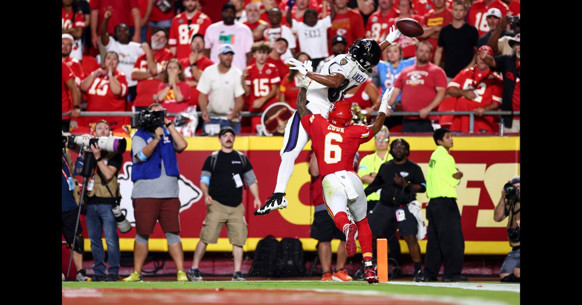 Isaiah Likely #80 of the Baltimore Ravens attempts to catch a pass in the end zone as Bryan Cook #6 of the Kansas City Chiefs defends during the fourth quarter of an NFL football game at GEHA Field at Arrowhead Stadium on September 5, 2024 in Kansas City, Missouri.