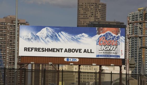 An outdoor billboard ad for Coors Light Beer is seen in this 2009 Denver, Colorado, spring cityscape photo.