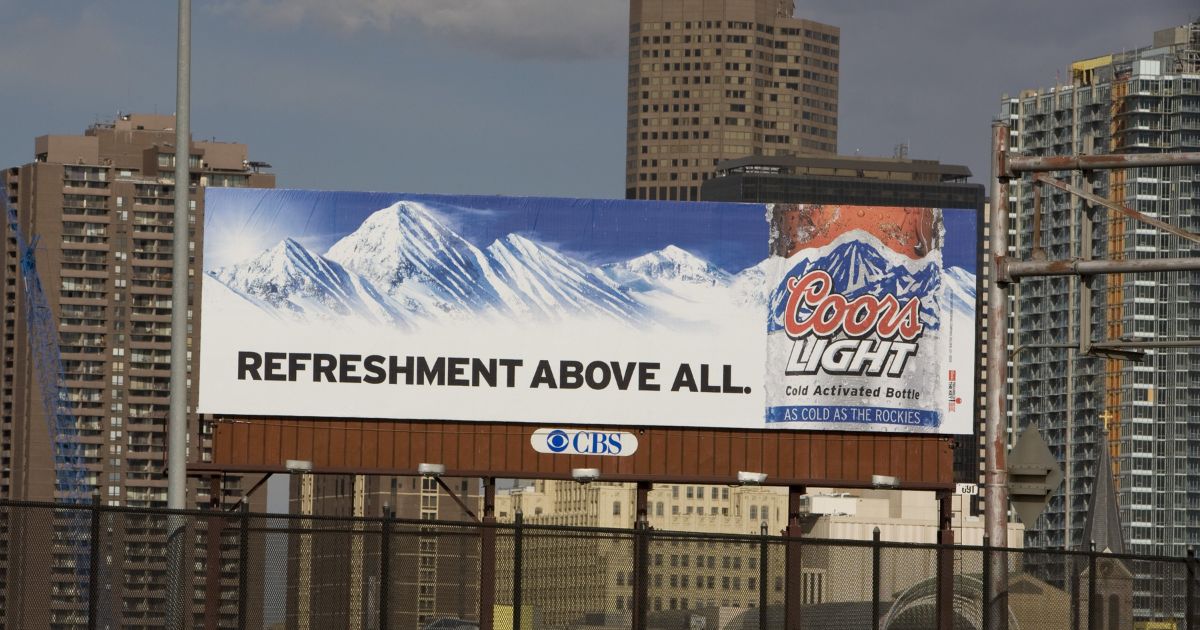 An outdoor billboard ad for Coors Light Beer is seen in this 2009 Denver, Colorado, spring cityscape photo.