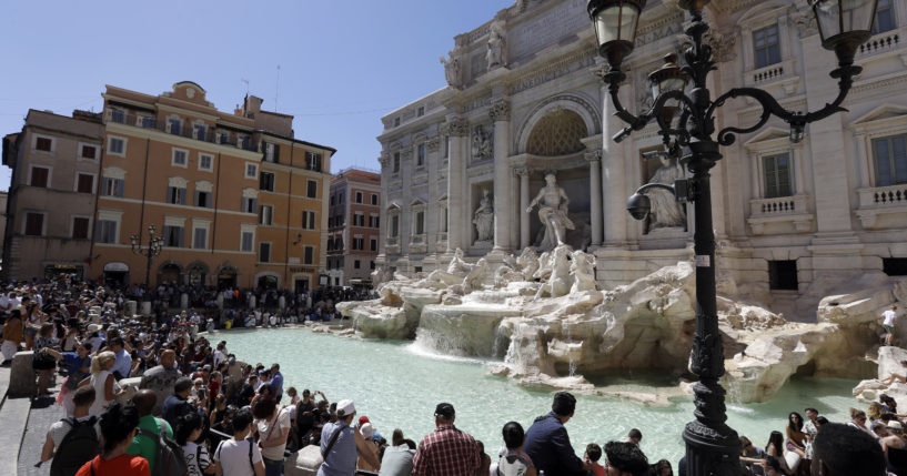 Tourists admire the Trevi Fountain in Rome, June 7, 2017.