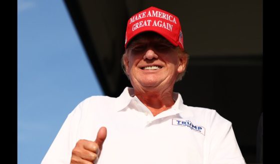 Former U.S. President Donald Trump looks on at the 18th green during day three of the LIV Golf Invitational - Miami at Trump National Doral Miami on April 7, 2024 in Doral, Florida.