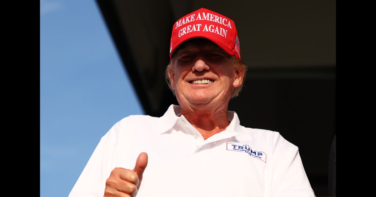 Former U.S. President Donald Trump looks on at the 18th green during day three of the LIV Golf Invitational - Miami at Trump National Doral Miami on April 7, 2024 in Doral, Florida.