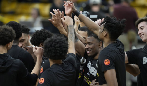 St. Bonaventure players huddle in the first half of a National Invitational Tournament basketball game on Tuesday, March 15, 2022, in Boulder, Colorado.