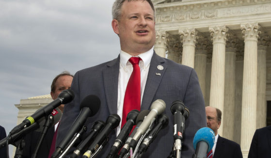 South Dakota Attorney General Jason Ravnsborg speaks to reporters in front of the U.S. Supreme Court in Washington on Sept. 9, 2019.