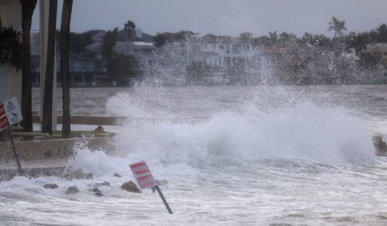 Waves from the Gulf of Mexico crash on shore as Hurricane Helene churns offshore on September 26, 2024 in St. Pete Beach, Florida.