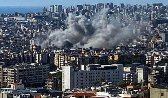 Thick smoke rises above the southern suburbs of Beirut after an Israel strike on September 20, 2024.