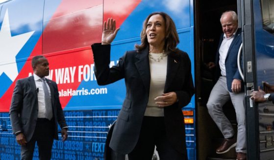 Democratic presidential candidate US Vice President Kamala Harris and her running mate, Minnesota Governor Tim Walz, disembark from their campaign bus in Savannah, Georgia, August 28, 2024, as they travel across Georgia for a 2-day campaign bus tour.