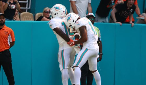 Tyreek Hill #10 of the Miami Dolphins and Jaylen Waddle #17 of the Miami Dolphins celebrate after Hill's receiving touchdown during the third quarter against the Jacksonville Jaguars at Hard Rock Stadium on September 8, 2024 in Miami Gardens, Florida.