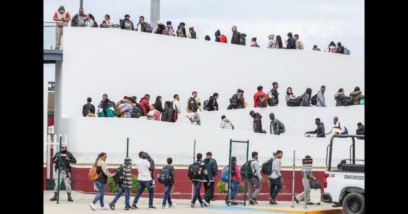 Hundreds of asylum seekers who used a CBP phone app to make an appointment, are led to their interviews with U.S. customs agents at the San Ysidro Border Crossing.