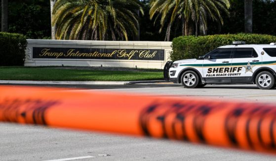 A sheriff's car blocks the street outside the Trump International Golf Club in West Palm Beach, Florida, on September 15, 2024 following a shooting incident at former US president Donald Trump's golf course. (Chandan Khanna - AFP / Getty Images)