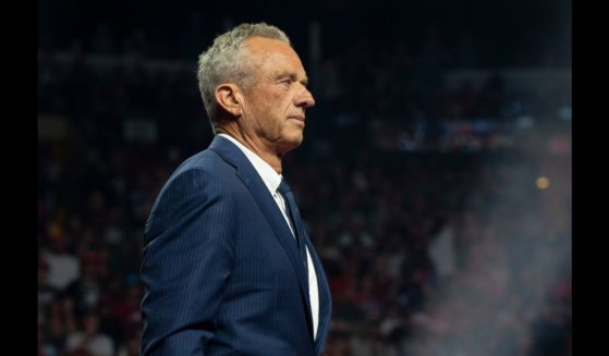 Former Independent presidential candidate Robert F. Kennedy Jr. listens during a campaign rally for Republican presidential nominee, former U.S. President Donald Trump at Desert Diamond Arena on August 23, 2024 in Glendale, Arizona.