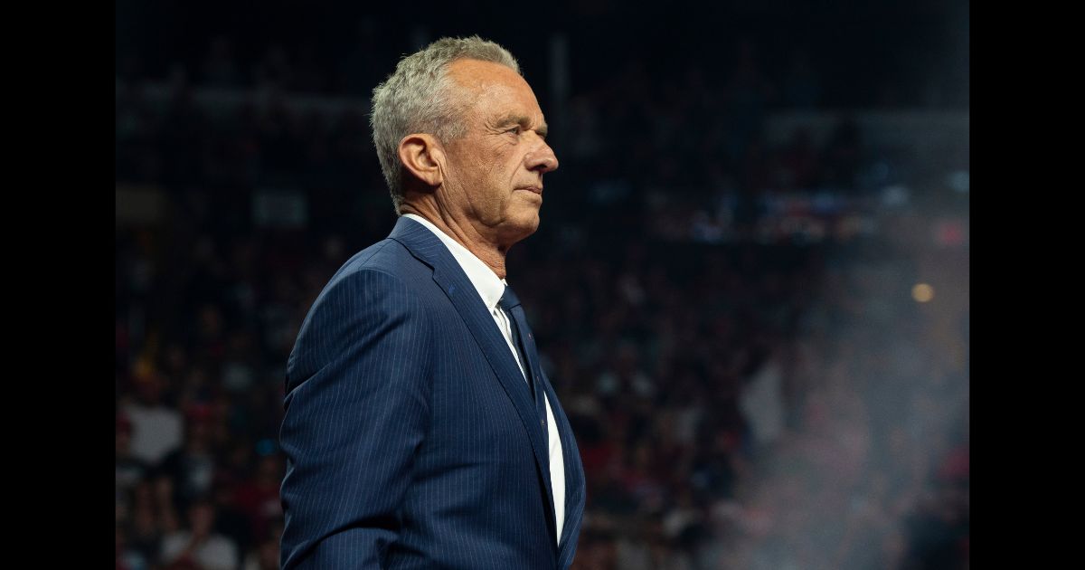 Former Independent presidential candidate Robert F. Kennedy Jr. listens during a campaign rally for Republican presidential nominee, former U.S. President Donald Trump at Desert Diamond Arena on August 23, 2024 in Glendale, Arizona.