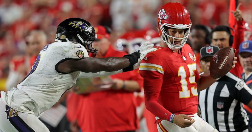 Roquan Smith #0 of the Baltimore Ravens has a late hit on quarterback Patrick Mahomes #15 of the Kansas City Chiefs during the fourth quarter at GEHA Field at Arrowhead Stadium on September 05, 2024 in Kansas City, Missouri.