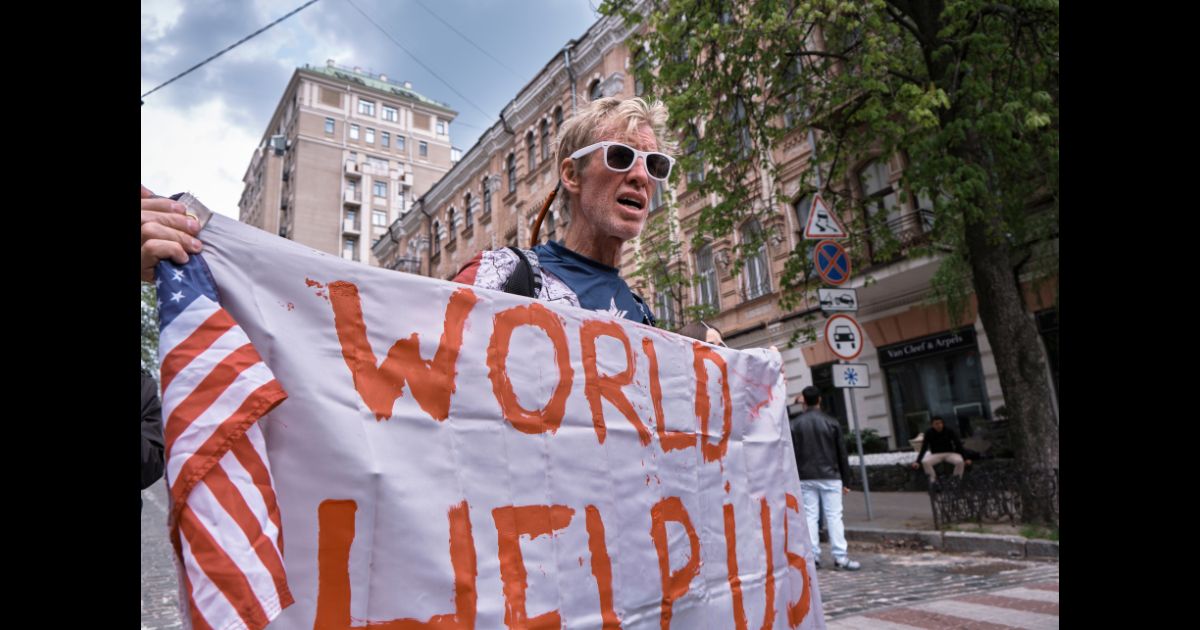 A man holds banner and shouts slogans during a demonstration in support of Mariupol defenders on May 3, 2022 in Kyiv, Ukraine.