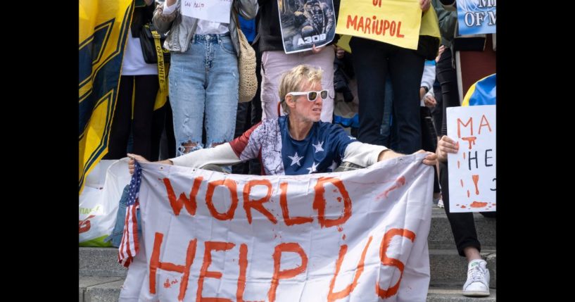 Ryan Routh holds a banner during a demonstration in support of Mariupol defenders on May 3, 2022 in Kyiv, Ukraine.