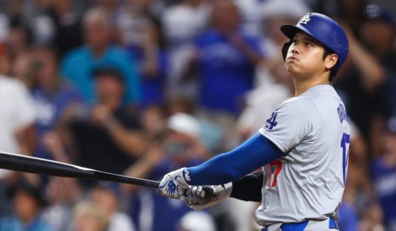 Shohei Ohtani #17 of the Los Angeles Dodgers hits a two-run home run, his 50th of the season, during the seventh inning against the Miami Marlins at loanDepot park on September 19, 2024 in Miami, Florida. Ohtani is now the first MLB player to have at least 50 home runs and 50 stolen bases in the same season.