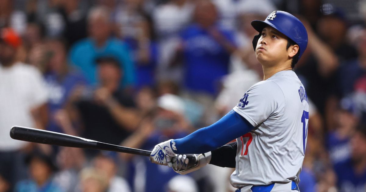 Shohei Ohtani #17 of the Los Angeles Dodgers hits a two-run home run, his 50th of the season, during the seventh inning against the Miami Marlins at loanDepot park on September 19, 2024 in Miami, Florida. Ohtani is now the first MLB player to have at least 50 home runs and 50 stolen bases in the same season.