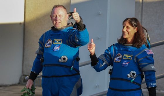 NASA’s Boeing Crew Flight Test Commander Butch Wilmore (L) and Pilot Suni Williams walk out of the Operations and Checkout Building on May 06, 2024 in Cape Canaveral, Florida.