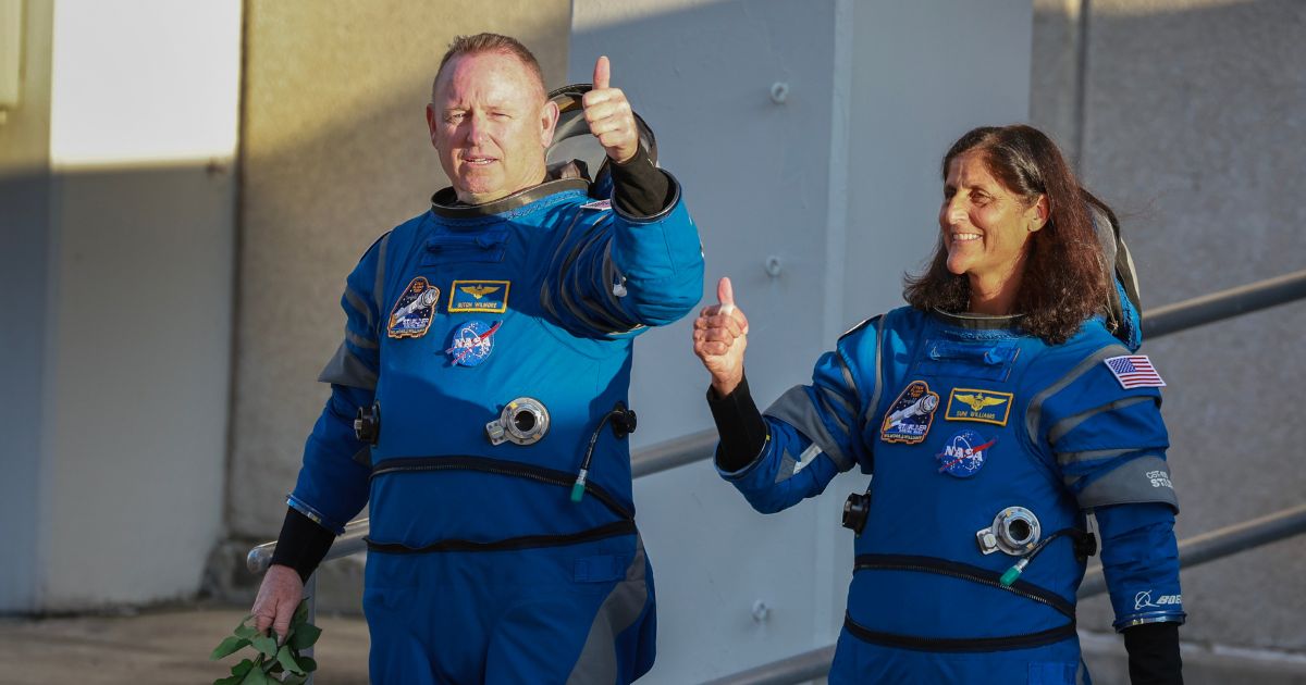 NASA’s Boeing Crew Flight Test Commander Butch Wilmore (L) and Pilot Suni Williams walk out of the Operations and Checkout Building on May 06, 2024 in Cape Canaveral, Florida.