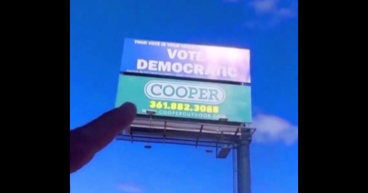 Gun Coating Company Takes Hilarious Action When ‘Vote Democratic’ Billboard Appears Above Shop