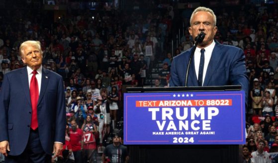 Former presidential candidate Robert F. Kennedy Jr. (R) speaks as Republican presidential nominee, former U.S. President Donald Trump listens during a campaign rally at Desert Diamond Arena on August 23, 2024 in Glendale, Arizona.