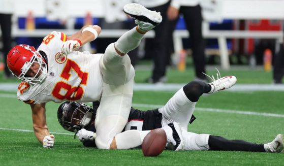 Jessie Bates III #3 of the Atlanta Falcons breaks up a pass intended for Travis Kelce #87 of the Kansas City Chiefs during the fourth quarter at Mercedes-Benz Stadium on September 22, 2024 in Atlanta, Georgia.