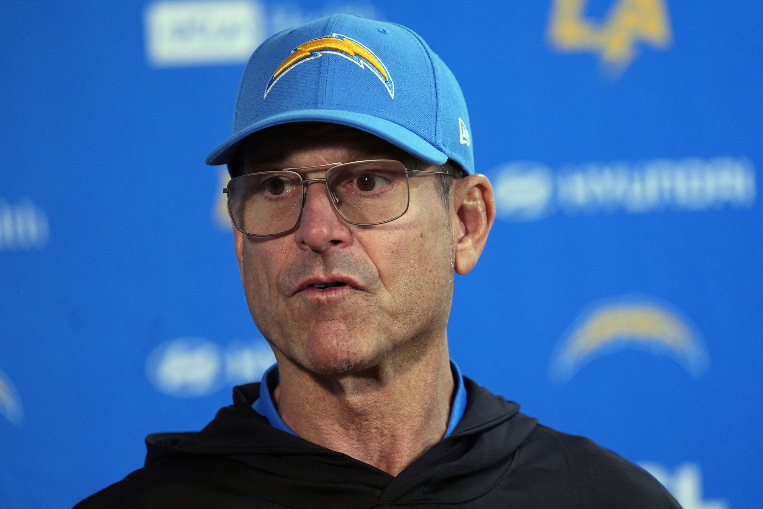 Los Angeles Chargers head coach Jim Harbaugh responds to a question during news conference after defeating the Denver Broncos in Denver, Colorado, on Sunday.