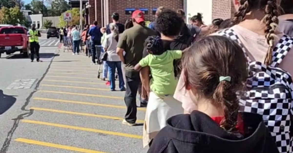 People in Asheville, North Carolina, wait outside of a Walmart in order to get supplies, but once inside, video showed that the shelves were empty.