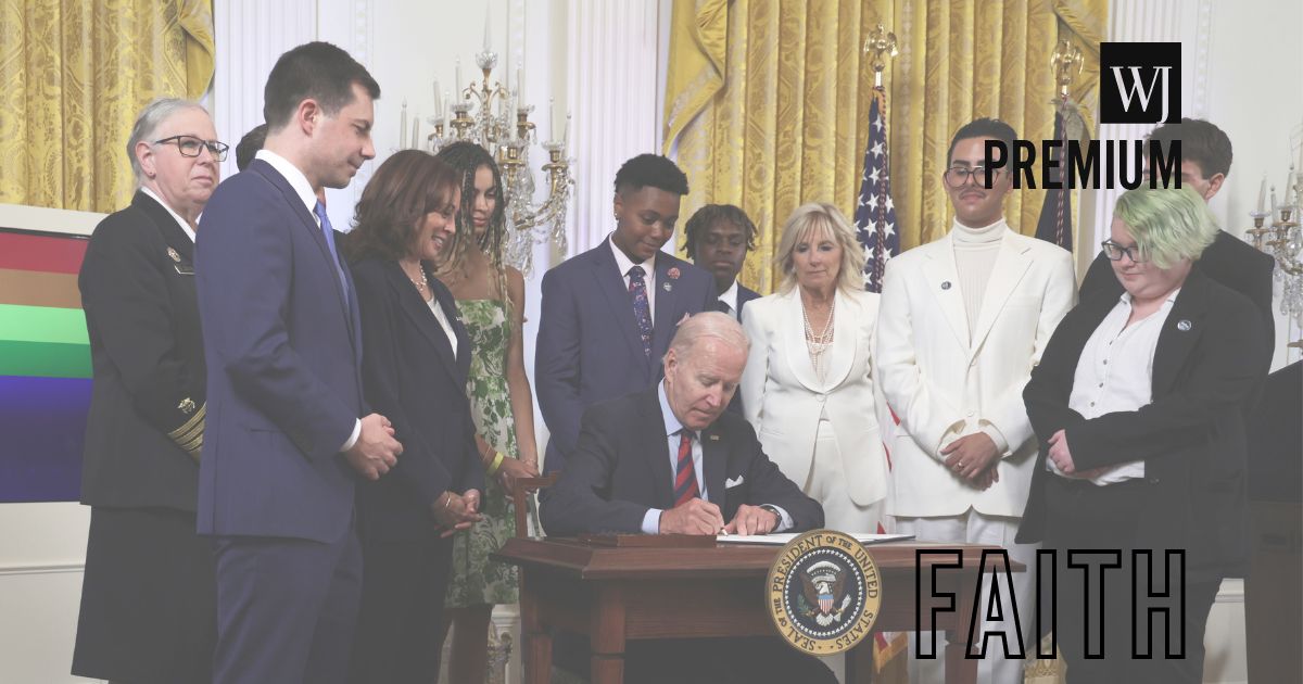 President Joe Biden signs an executive order for equality for LGBT individuals as Transportation Secretary Pete Buttigieg, second from left, Vice President Kamala Harris, third from left, first lady Jill Biden, third from right, Javier Gomez, second from right, and other LGBT advocates look on during a pride event at the East Room of the White House in Washington, D.C., on June 15, 2022.