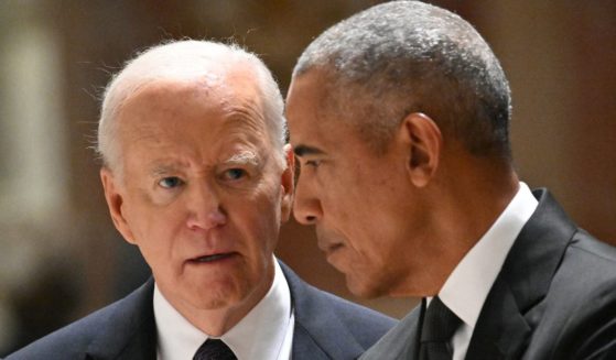 President Joe Biden, left, had what appeared to be an intense conversation with former President Barack Obama at a memorial service Wednesday for Ethel Kennedy in Washington, D.C.