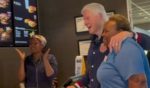 Former President Bill Clinton poses with employees at a Georgia McDonald's.