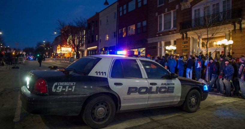 In a file photo from Jan. 7, 2016, a Burlington Police car blocks the road outside of the Flynn Center for the Performing Arts where then-Republican presidential front-runner Donald Trump was hosting a campaign event. Burlington has struggled with a growing crime problem since its leftist city council voted to cut its police force in solidarity with the 