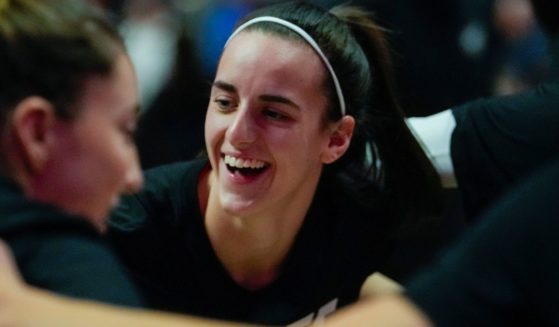 Caitlin Clark of the Indiana Fever huddles with teammates before playing the Connecticut Sun in Game Two of the 2024 WNBA Playoffs first round in Uncasville, Connecticut, on Sept. 25.