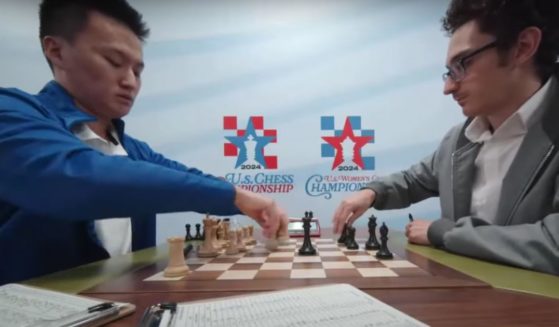 Christopher Yoo, 17, left, was reportedly angry after losing a match to Fabiano Caruana, right.