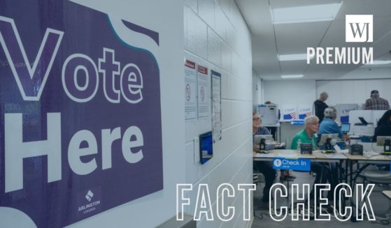 Poll workers sit ready to accept voters on the first day of Virginia's in-person early voting on Sept.20 in Arlington, Virginia.