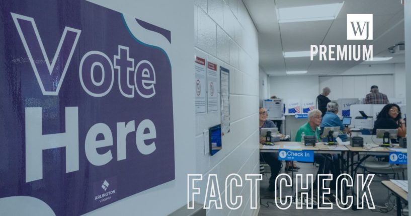 Poll workers sit ready to accept voters on the first day of Virginia's in-person early voting on Sept.20 in Arlington, Virginia.