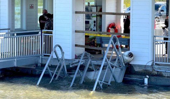 A portion of the gangway which collapsed Saturday afternoon remains visible on Sapelo Island, Georgia, on Sunday.