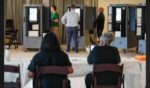 Voters cast ballots in Georgia's primary election at a polling location on May 21, 2024, in Atlanta, Georgia