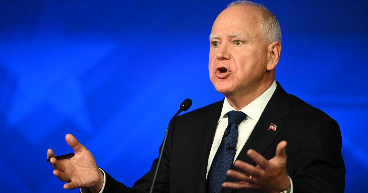 Gov. Tim Walz gestures during the vice presidential debate against Sen. J.D. Vance in New York City on Tuesday.