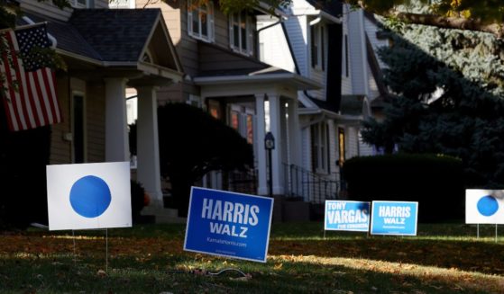 Harris-Walz campaign signs are pictured in people's front yards in Omaha, Nebraska, on Oct. 23.