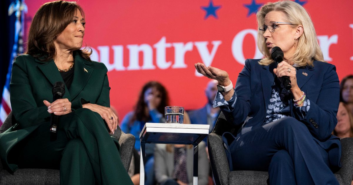 Vice President Kamala Harris, left, and former Rep. Liz Cheney, right, speak at a town hall in Royal Oak, Michigan, on Monday.