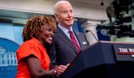 President Joe Biden, accompanied by White House press secretary Karine Jean-Pierre, jokes about taking so many questions during a news conference in the Brady Press Briefing Room at the White House in Washington, D.C., on Friday.