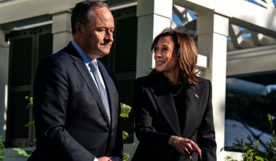 Second gentleman Doug Emhoff, left, and Vice President Kamala Harris, right, plant a pomegranate tree at the Vice President's residence at the U.S. Naval Observatory in Washington, D.C., on Monday.