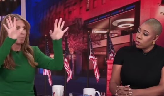 MSNBC panelist Nicolle Wallace, left, goes off after the vice presidential debate on Tuesday as fellow panelist Symone Sanders, right, listens.