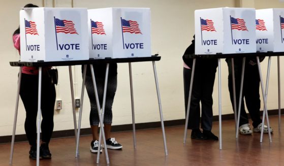 People cast their in-person early ballot for the 2024 general election at the Northwest Activities Center in Detroit, Michigan, on Tuesday.